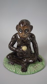 French Majolica seated monkey figure