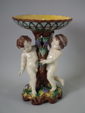 Majolica putti with grapes compote