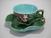 Minton Majolica floral cup and leaf-like saucer