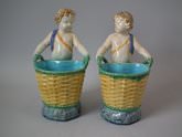 Pair Minton Majolica Putti figures with baskets