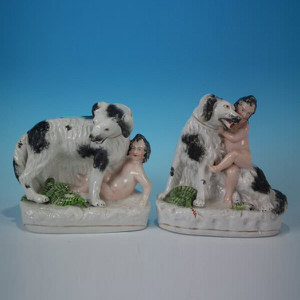 Pair Staffordshire pottery children, dog & snake figures